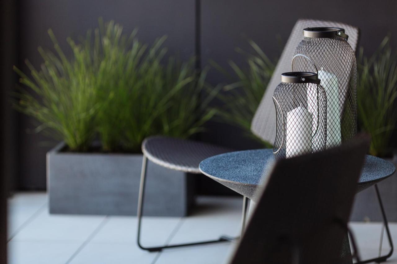 One Global Resorts Green Square Sydney Exterior photo The "Butterfly" chair