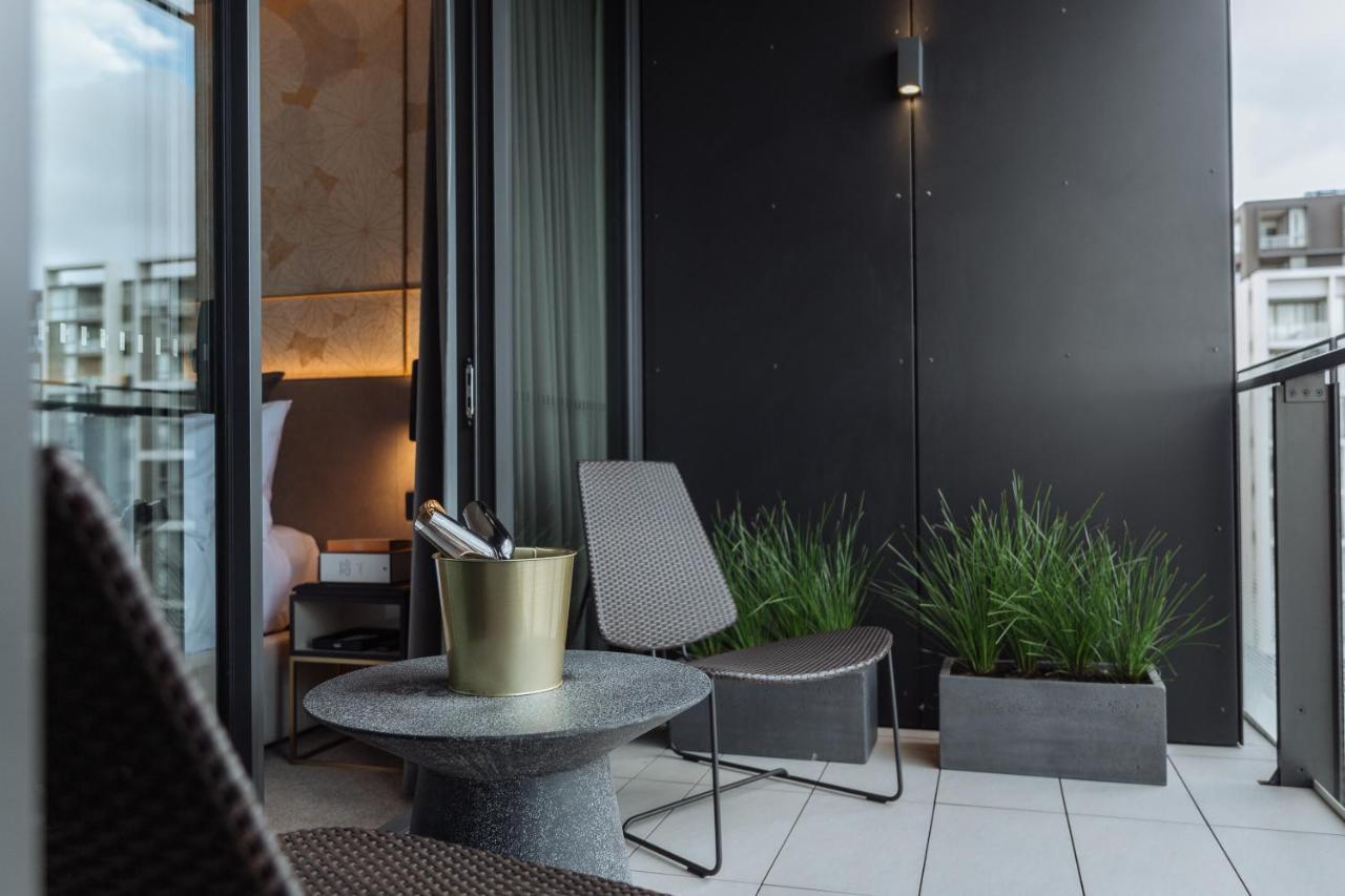 One Global Resorts Green Square Sydney Exterior photo The balcony of a penthouse apartment at The Standard London